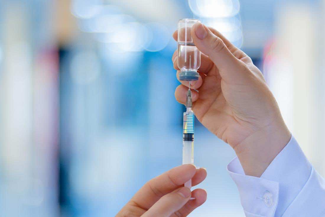 doctor preparing vaccine shot